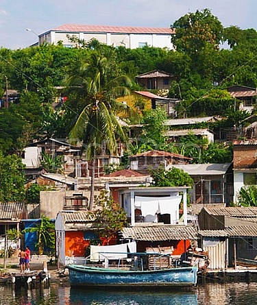 Homes and boats in the Bay of Santiago de Cuba