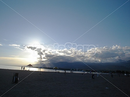 sun begins to sit over Issyk Kul Lake