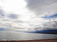 sun tries to get through the clouds at Issyk Kul Lake